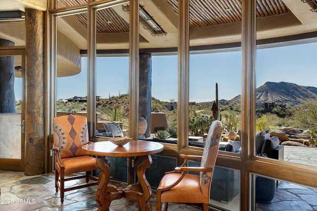 sunroom with a mountain view