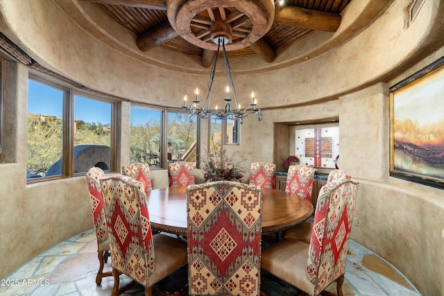 dining area featuring wood ceiling and a chandelier