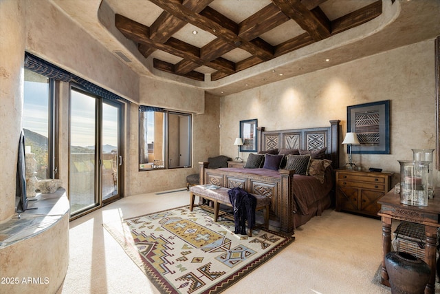 carpeted bedroom with beamed ceiling, coffered ceiling, access to outside, and a towering ceiling