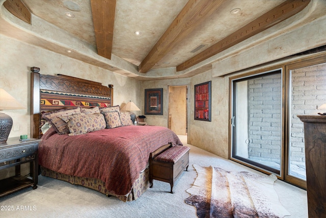 carpeted bedroom with access to exterior and beam ceiling