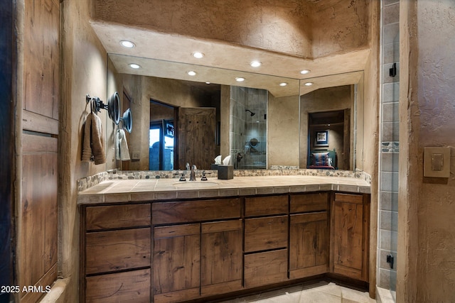 bathroom with vanity and walk in shower