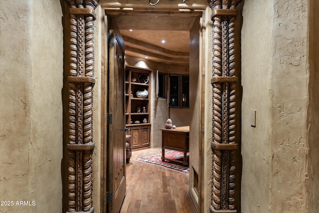 wine cellar featuring wood-type flooring