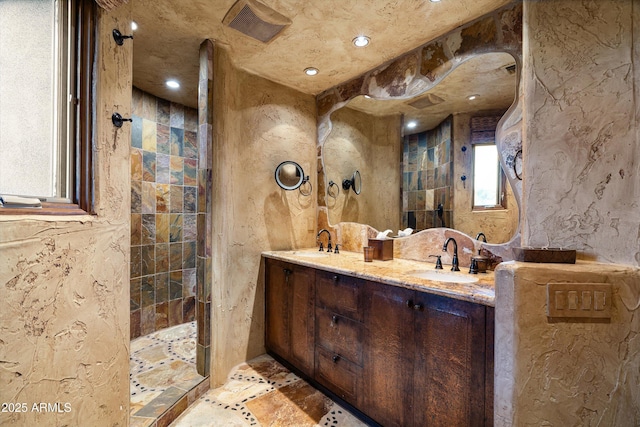 bathroom featuring vanity and a shower