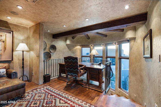 office space featuring beamed ceiling and hardwood / wood-style floors