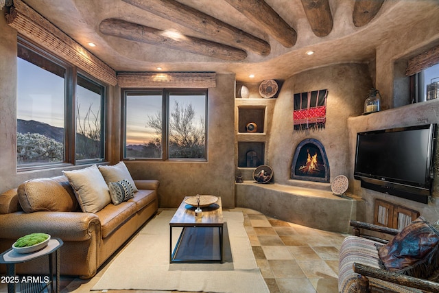 living room with a mountain view and beam ceiling