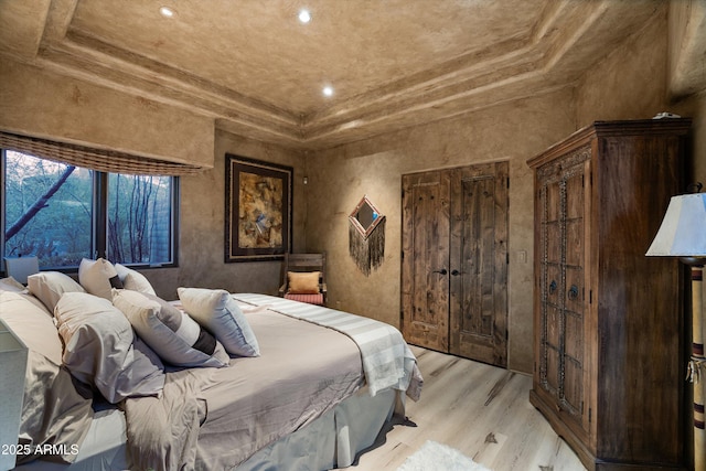 bedroom with a closet and light wood-type flooring