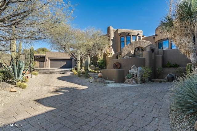 adobe home featuring a garage