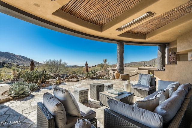 view of patio featuring a mountain view and an outdoor hangout area