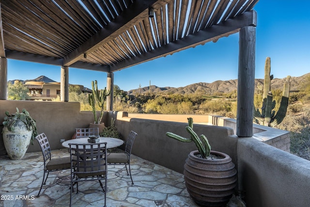 view of patio / terrace featuring a mountain view