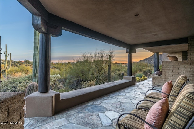 view of patio terrace at dusk