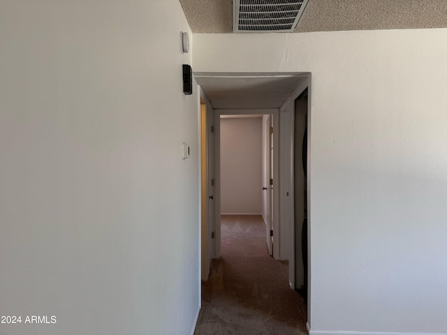 hall featuring carpet