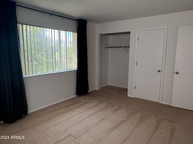 unfurnished bedroom with carpet floors