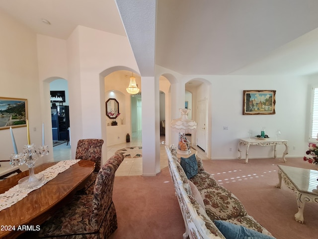 carpeted dining room featuring a high ceiling