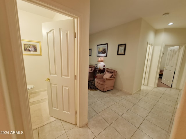 hallway with light tile patterned floors