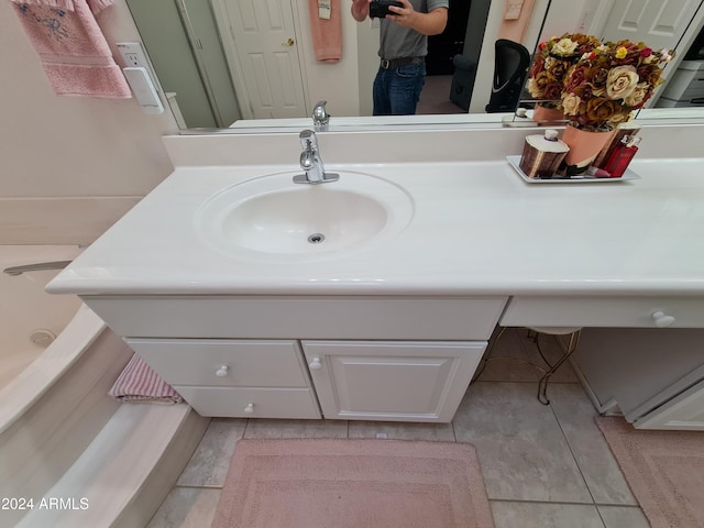 bathroom with tile patterned floors and vanity