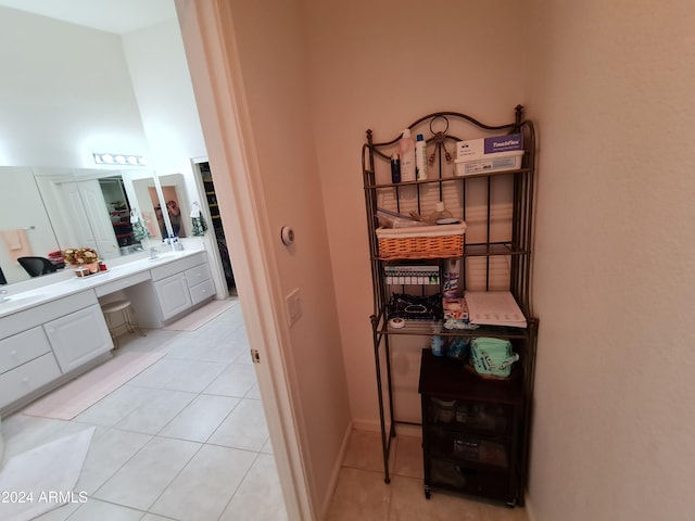 bathroom featuring tile patterned flooring and vanity