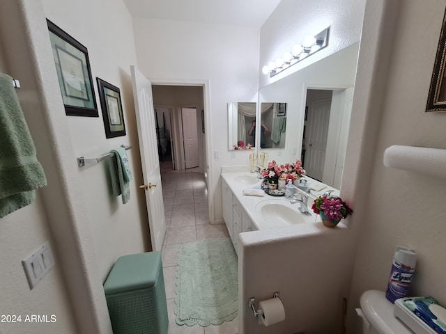 bathroom featuring tile patterned floors, vanity, and toilet