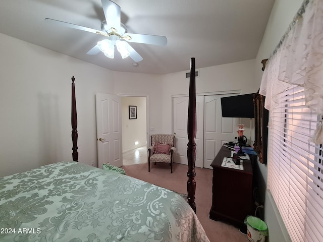 carpeted bedroom with a closet and ceiling fan