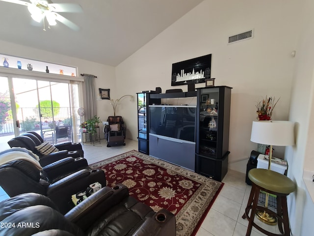 living room with light tile patterned floors, ceiling fan, and lofted ceiling