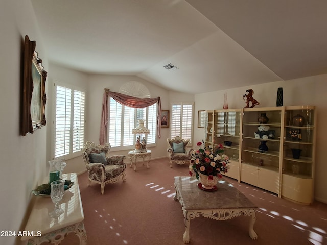 sitting room with carpet flooring and lofted ceiling