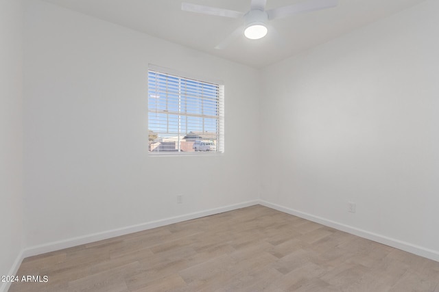 unfurnished room with ceiling fan and light hardwood / wood-style flooring