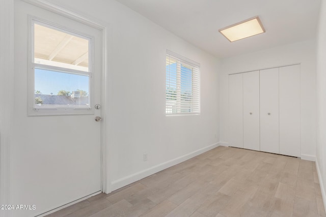 entryway with light hardwood / wood-style floors