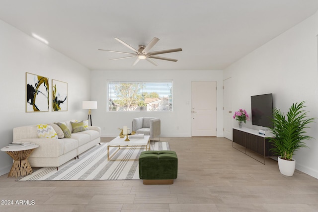 living room featuring ceiling fan and light hardwood / wood-style floors