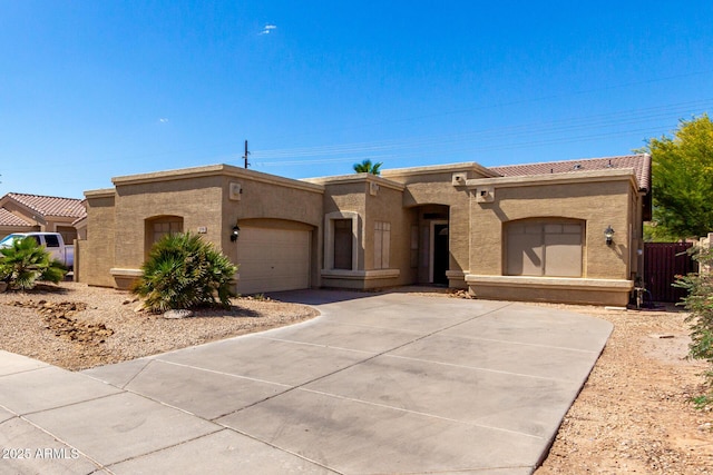 870 E Megan St, Gilbert, AZ 85295 - view of front of home with stucco siding, an attached garage, a tile roof, and concrete driveway