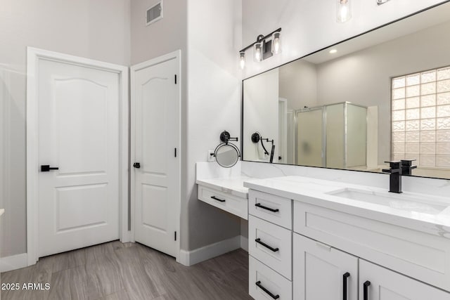 870 E Megan St, Gilbert, AZ 85295 - bathroom with a stall shower, baseboards, and vanity