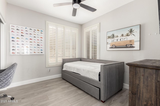 870 E Megan St, Gilbert, AZ 85295 - bedroom with baseboards, wood finished floors, and ceiling fan