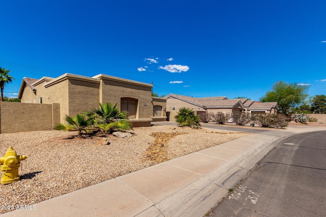 870 E Megan St, Gilbert, AZ 85295 - view of front of property with stucco siding and fence