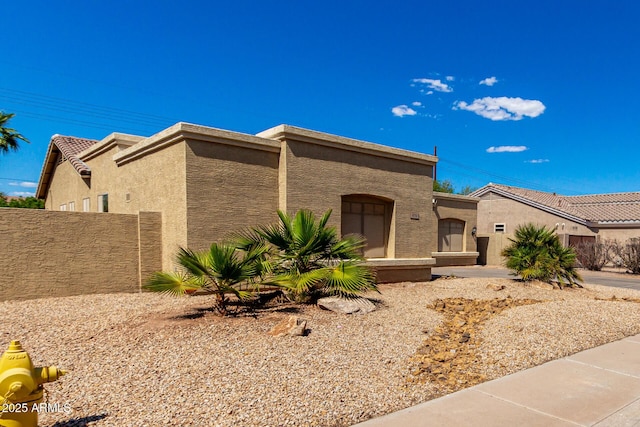 870 E Megan St, Gilbert, AZ 85295 - view of front of house featuring stucco siding and fence