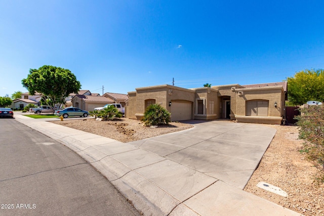 870 E Megan St, Gilbert, AZ 85295 - view of front of property with an attached garage, concrete driveway, and stucco siding