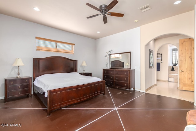 bedroom featuring ensuite bath and ceiling fan