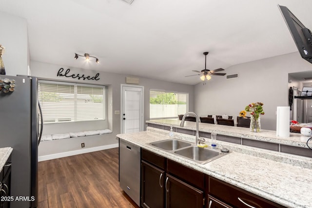 kitchen featuring a ceiling fan, visible vents, dark wood finished floors, a sink, and appliances with stainless steel finishes