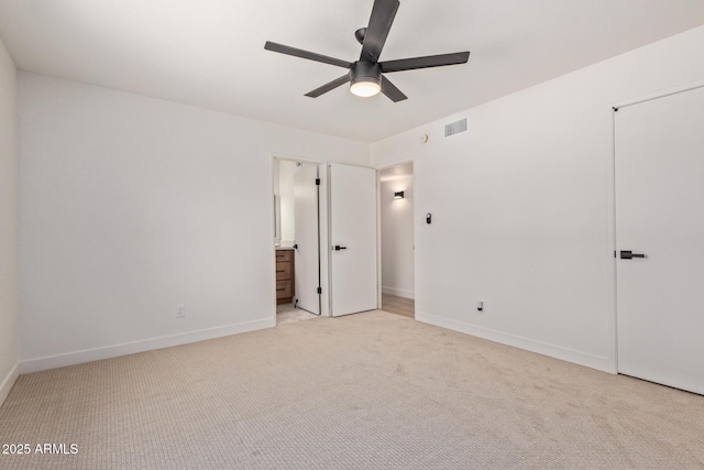 802 E Navajo Ave, Apache Junction, AZ 85119 - unfurnished bedroom with carpet, connected bathroom, and a ceiling fan
