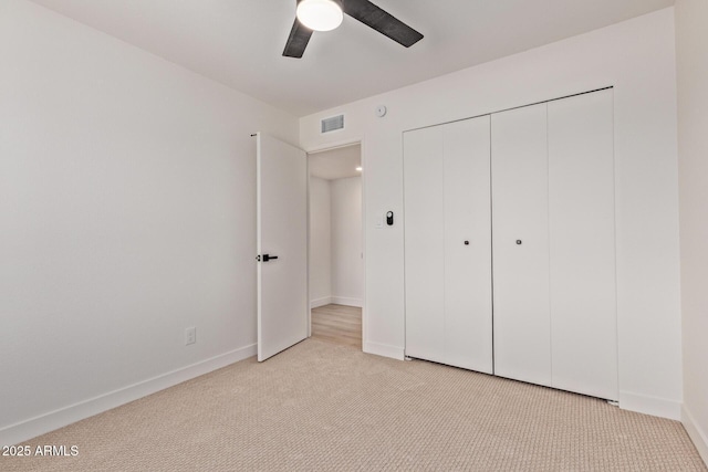 802 E Navajo Ave, Apache Junction, AZ 85119 - unfurnished bedroom with light colored carpet, a closet, and a ceiling fan