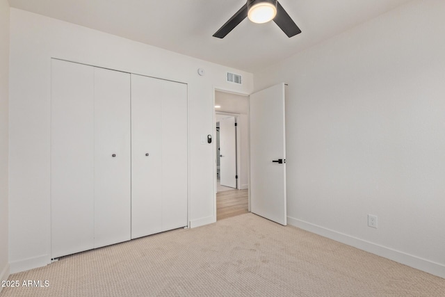 802 E Navajo Ave, Apache Junction, AZ 85119 - unfurnished bedroom with carpet flooring, a closet, and a ceiling fan