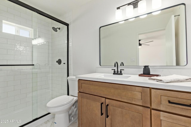 802 E Navajo Ave, Apache Junction, AZ 85119 - bathroom with a shower stall, vanity, marble look tiles, and ceiling fan