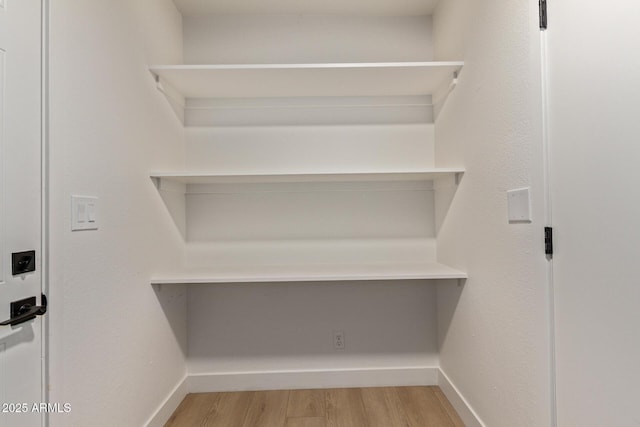 802 E Navajo Ave, Apache Junction, AZ 85119 - walk in closet featuring light wood-type flooring