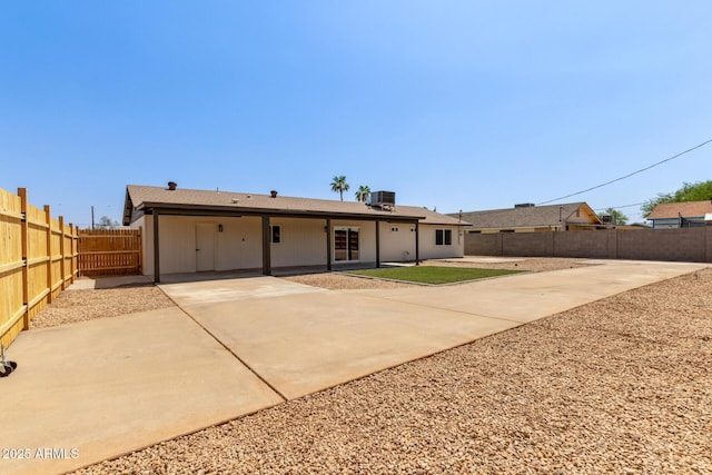802 E Navajo Ave, Apache Junction, AZ 85119 - view of front of home featuring driveway, a fenced backyard, and a patio area