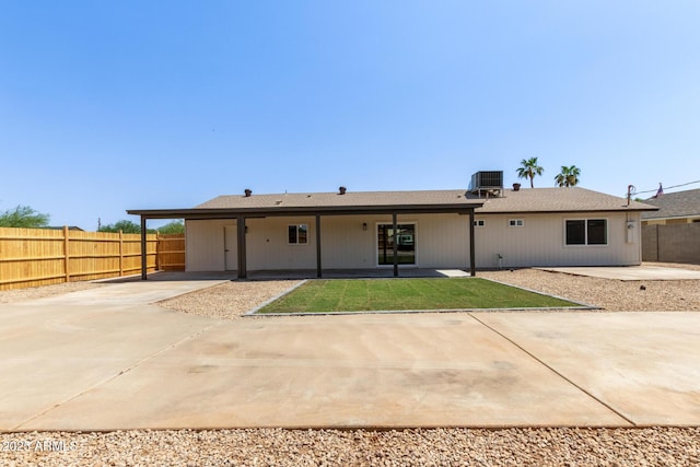 802 E Navajo Ave, Apache Junction, AZ 85119 - rear view of house with a patio area, a carport, and driveway