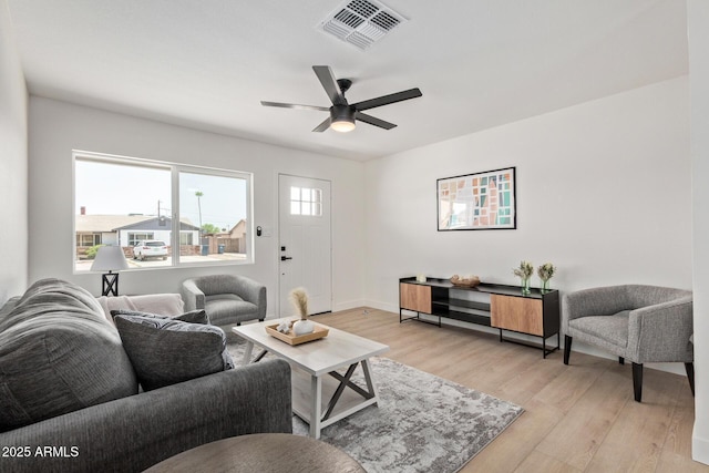 802 E Navajo Ave, Apache Junction, AZ 85119 - living room with light wood finished floors and ceiling fan