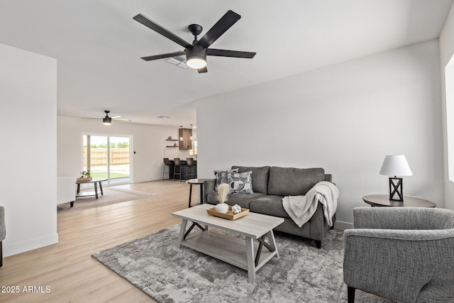 802 E Navajo Ave, Apache Junction, AZ 85119 - living area featuring a ceiling fan and light wood finished floors