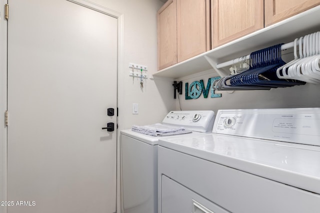 laundry room featuring cabinet space and washing machine and dryer