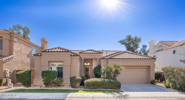 mediterranean / spanish-style house featuring a garage