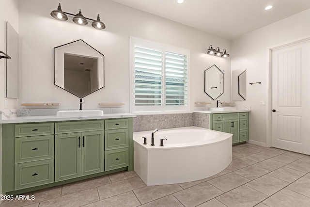 bathroom featuring a washtub, vanity, and tile patterned flooring