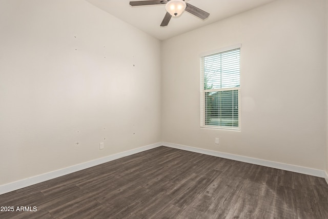 empty room with dark wood-type flooring and ceiling fan