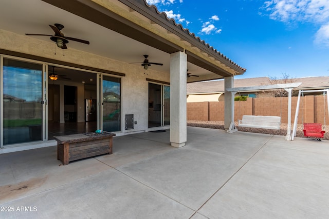 view of patio featuring ceiling fan