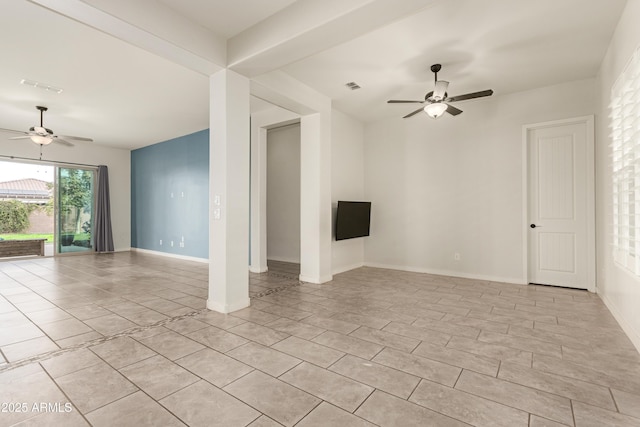 unfurnished living room featuring ceiling fan and light tile patterned floors